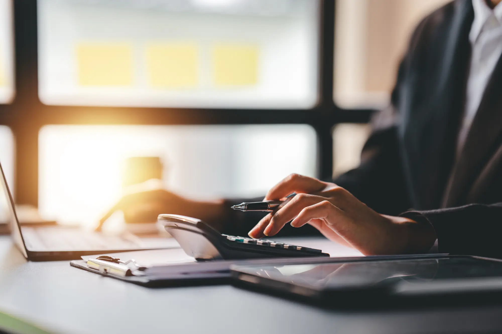 Portrait of a woman working on a tablet computer in a modern office